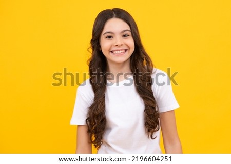 Little kid girl 12,13, 14 years old on isolated background. Children studio portrait. Emotional kids face. Happy teenager, positive and smiling emotions of teen girl. Royalty-Free Stock Photo #2196604251