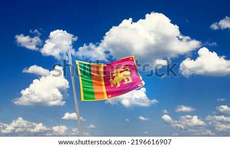  Sri Lanka national flag waving in beautiful clouds.