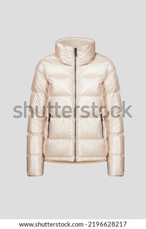 Ghost mannequin, Beige women's puffer down jacket without human isolated on white background. Winter clothes zipped with pockets for female, ladies. 3d voluminous cloth. Template, mock up Royalty-Free Stock Photo #2196628217