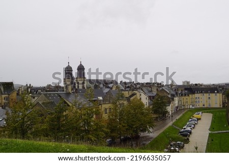The view of streets in the French city of Sedan from the wall of the castle of Sedan which is located in the middle of the city, on a rainy autumn day. Royalty-Free Stock Photo #2196635057