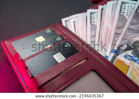 top view of wallet with money and credit cards isolated on plain background. Wealth. abundance. profit