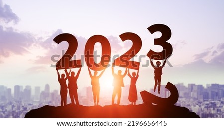 New year concept of 2023. New year's card. Multi ethnic people showing 2023. Royalty-Free Stock Photo #2196656445