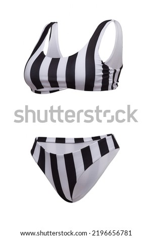 Close-up shot of a two-piece swimsuit. The bathing suit consists of a top with a striped print and swim bottoms with a striped print. The bathing suit is isolated on a white background. Side view.