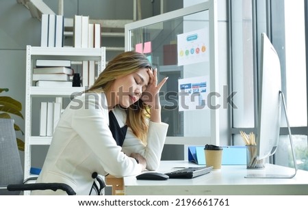 busimess Asian woman serious and concern in working job at office