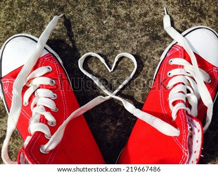 heart Love shape symbol with sneakers teen baseball urban 'teen love' or healthy heart exercise concept red boots with laces in heart shape stock, photo, photograph, picture, image