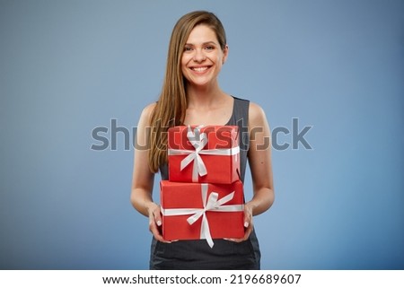 Business woman holding paper gift boxes.