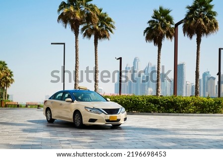 Taxi, driving on a street of Dubai Royalty-Free Stock Photo #2196698453