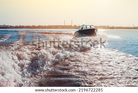 Motor boat breaking the waves. Summer vacation on the water. Travel and leasure activities concept