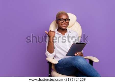 Photo of funny cute short hair lady wear smart casual look reading device thumb empty space isolated purple color background