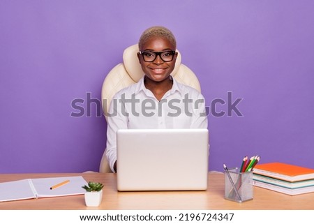 Photo of charming pretty short hair woman dressed smart casual outfit sitting table working modern gadget isolated violet color background