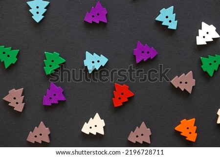 Colored figures in the form of Christmas tree on a black background
