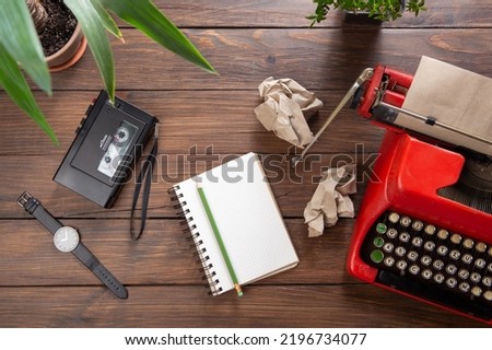 Journalism or blogging concept - vintage typewriter on the wooden desk, top view