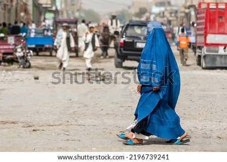Afghan woman in hijab in Kabul, natives of Afghanistan on streets of the city Royalty-Free Stock Photo #2196739241