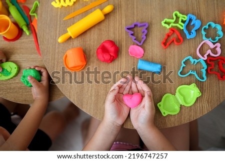 Children sculpt from plasticine, classes in a kids club, the concept of education and child development. Royalty-Free Stock Photo #2196747257