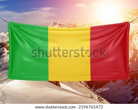 Mali national flag cloth fabric waving on beautiful background.