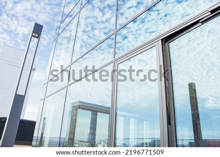 Clouds reflecting in the skyscraper