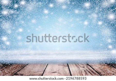 Winter background - dark wooden rustic background covered with snow. Abstract Snowy Christmas Background. Christmas winter background made of snowflakes and snow with empty copy space for your text