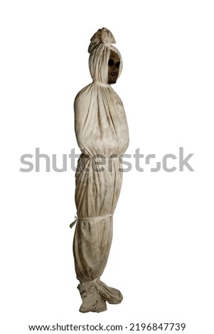 Indonesian ghost called pocong, covered with a linen shroud, isolated over white background Royalty-Free Stock Photo #2196847739