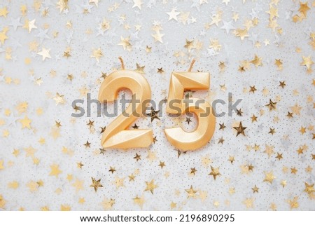 Number 25 twenty five golden celebration birthday candle on Festive Background. twenty five years birthday. concept of celebrating birthday, anniversary, important date, holiday Royalty-Free Stock Photo #2196890295
