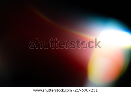 prism light leak texture for photo overlay and effect. lens flare in abstract background. bokeh effect with glow and magical lights on black background. Royalty-Free Stock Photo #2196907231