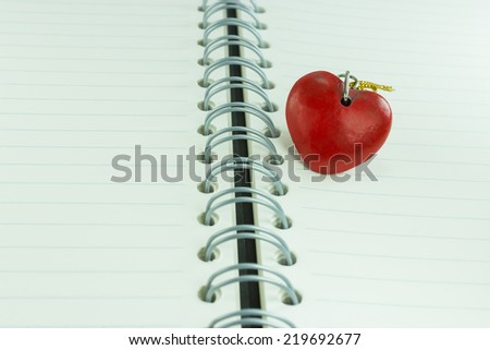 Notebook with heart. Send message to your lover in Valentine's day