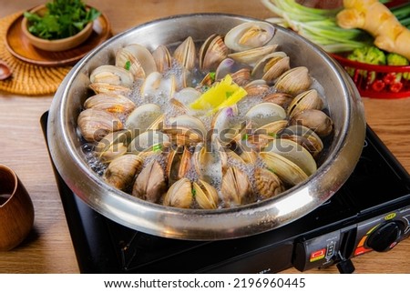 Close - up of steamed clams  (Surf , Short necked , Carpet , Venus shell, Baby clam) Royalty-Free Stock Photo #2196960445