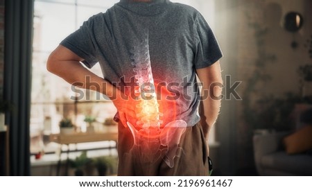 VFX Back Pain Augmented Reality Animation. Close Up of a Senior Male Experiencing Discomfort in a Result of Spine Trauma or Arthritis. Massaging and Stretching the Back to Ease the Injury.