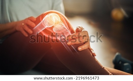 VFX Joint and Knee Pain Augmented Reality Edit. Close Up of a Senior Woman Experiencing Discomfort in a Result of Leg Trauma or Arthritis. Massaging the Muscles to Ease the Injury. Royalty-Free Stock Photo #2196961473