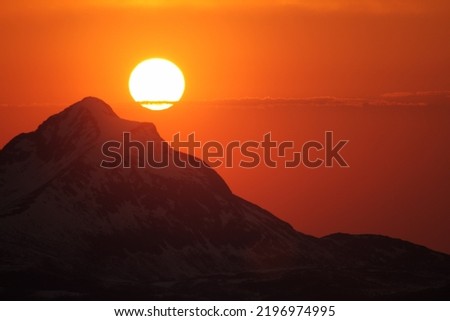 Sunset over the Senja mountains as seen from Andørja. It will soon be midnight sun. Norway Royalty-Free Stock Photo #2196974995