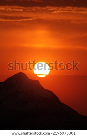 Sunset over the Senja mountains as seen from Andørja. It will soon be midnight sun. Norway Royalty-Free Stock Photo #2196975001