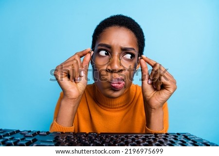 Close-up photo of funky funny grumpy face of businesswoman thinking new project strategy isolated on blue color background
