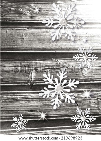 Christmas winter composition with snowflakes on the wooden background