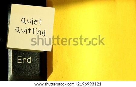Yellow copy space background, keyboard END and stick note written text QUIET QUITTING - concept of doing only what job demands and nothing more, not taking corporate job too seriously Royalty-Free Stock Photo #2196993121