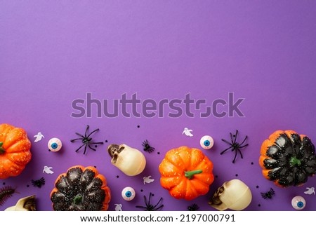 Halloween decorations concept. Top view photo of pumpkins skulls spooky eyes spiders centipede ghost silhouettes and confetti on isolated violet background with empty space