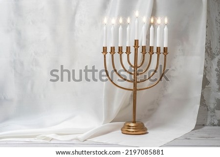 Jewish Hanukkah Menorah 9 Branch Candlestick. Holiday Candle Holder. Nine-arm candlestick. Traditional Hebrew Festival of Lights candelabra. Background for design with copy space. Royalty-Free Stock Photo #2197085881