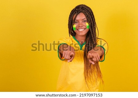 black woman young brazilian soccer fan. pointing at camera, choose, choosing you.