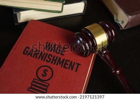 Wage garnishment is shown using a text Royalty-Free Stock Photo #2197121397