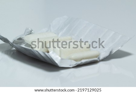  white chewing gum in an open package