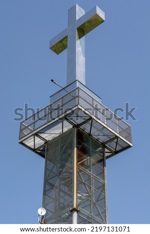 Lookout tower or observation tower with the steel cross on the top. Levice. Slovakia.