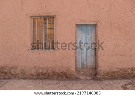 Door and window in adobe house in San Pedro de Atacama, Chile Royalty-Free Stock Photo #2197140085