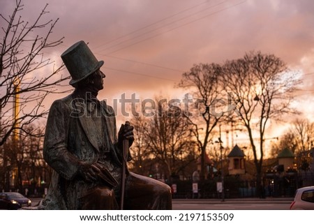 The Statue of H.C. Andersen at the City Square in Copenhagen on the sunset Royalty-Free Stock Photo #2197153509
