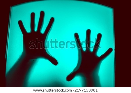 scary picture of hands behind glass, horror ghost behind door, Halloween  concept