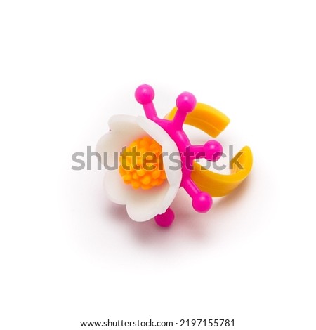 Colorful set of children's toys, beads, decorations isolated on white background.