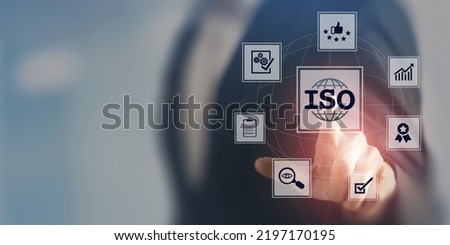 ISO standards quality control, assurance and warranty business technology concept. Touching on screen with ISO and globe icons on smart background. ISO Standard certification. Modern ISO banner. Royalty-Free Stock Photo #2197170195