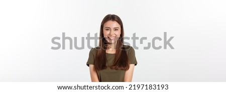 Close-up portrait of yong woman casual portrait in positive view, big smile, beautiful model posing in studio over white background. Royalty-Free Stock Photo #2197183193