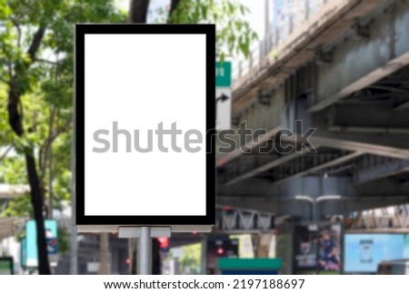 Outdoor pole billboard with mock up white screen on footpath and clipping path