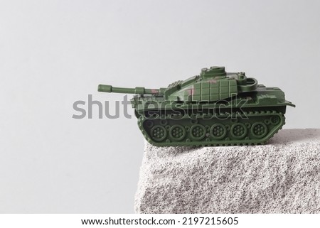 Toy Military tank on the rock