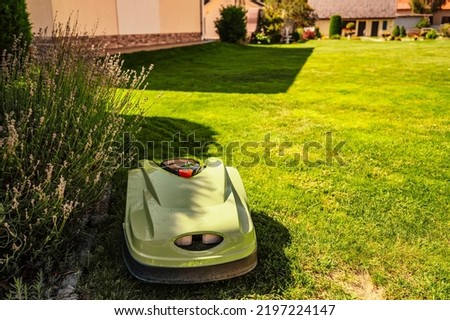 Lawn mower cut grass. Garden work. Electric Rotary lawn mower machine. Excellent au pair, Automatic Robotic Lawnmower.