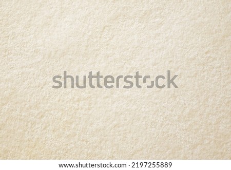 Pastel yellow towel blanket texture background. Soft and fluffy fabrics. Royalty-Free Stock Photo #2197255889