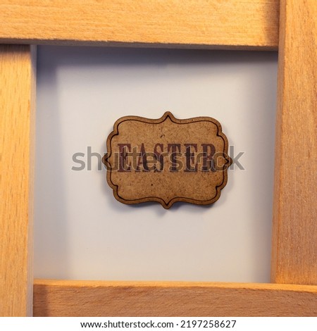 Easter written on wooden surface. Wooden concept. Celebrations and special occasions